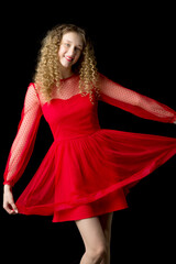 Joyful smiling blonde girl lift hem of red dress