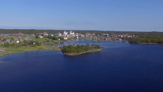 Solovki kremlin Russia aerial drone long approach, old russian tower on island 4K