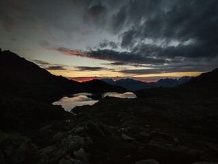 sunrise, sunset, high mountain lake adamello brenta, italy, dolomites