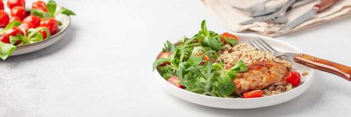 Turkey fillet or chicken, quinoa and vegetable salad in plate. Diet concept food.