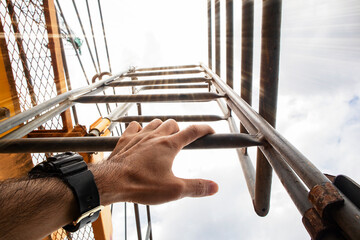 Climb the stairs to repair the tower crane.