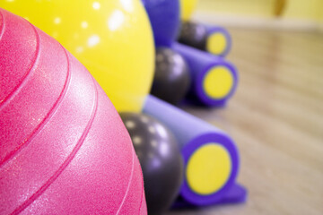Colored balls and rollers for pilates classes