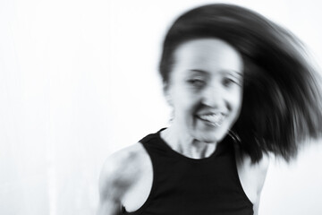 Motion blur portrait of woman over 40