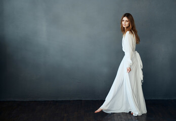 Fototapeta na wymiar cheerful Woman in white dress dance elegant style luxury romance