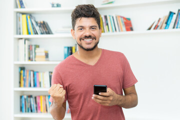 Successful video call of hispanic man with mobile phone