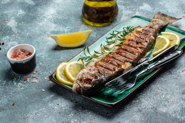 Baked trout fish, Grilled trout barbeque with lemon, Healthy eating concept. banner, menu, recipe place for text, top view