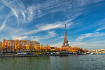 Fototapeta premium Paris France, city skyline at Eiffel Tower and Seine River Debilly Footbridge with autumn foliage season