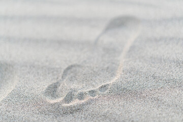 closeup of footstep in sand