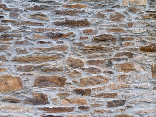Ancient natural brown stone wall background