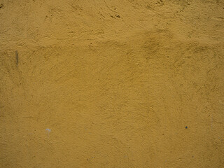 The texture of a plastered yellow wall