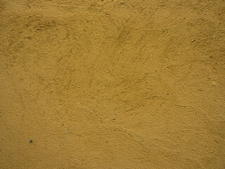 The texture of a plastered yellow wall