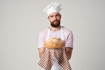bearded chef with bread in the hands of gourmet professionals work