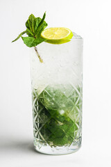 Classic mojito isolated on white background. Summer menu, cold refreshing beverage for hot weather.