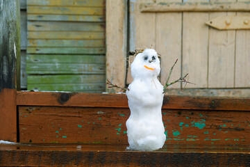 Little snowman as winter house spirit