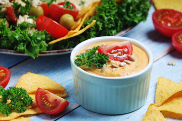Hummus with vegetables salad and nachos	