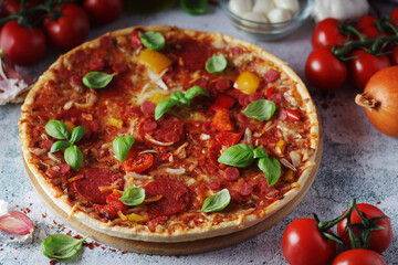 Pizza with salami and basil	