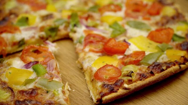 Freshly baked vegetarian pizza on a wooden plate - food photography