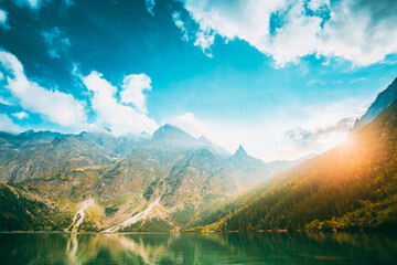 Tatra National Park, Poland. Famous Mountains Lake Morskie Oko Or Sea Eye Lake In Summer Evening. Beautiful Sun Sunset Sunrays Above Tatras Lake Landscape © Great Brut Here