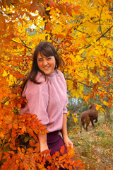 Girl in the autumn wood