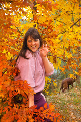 Girl in the autumn wood