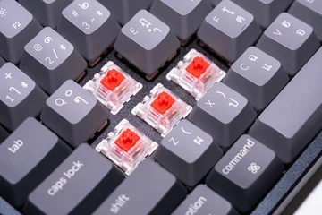 Papier Peint photo K2 Closeup of red switch on machanical gaming keyboard.