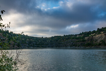 Lake in an abandoned granite quarry. Ecology. Industrial tourism.