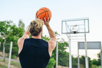 Back view young sporty muscular strong european sportsman man 20s wear sports clothes training...