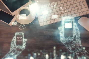 Multi exposure of envelop technology theme drawing over table with phone. Top view. Concept of electronic mail.