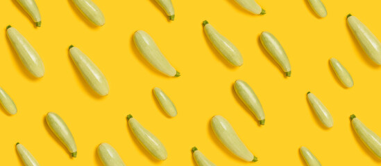 Art pattern of fresh organic vegetable marrow on yellow color background. Healthy eating