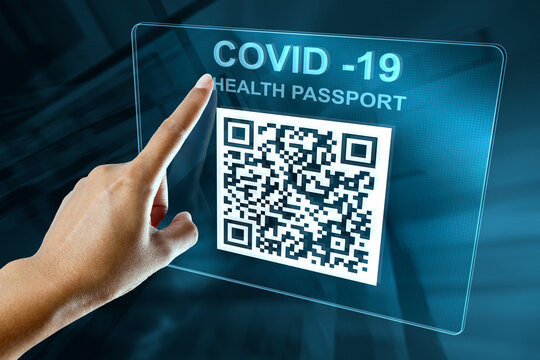 A Woman's Hand Opens The QR Of The Health Pass On A Digital Screen
