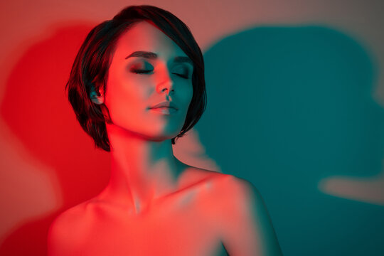 Photo of dreamy tempting pretty short hairstyle woman close eyes enjoy isolated red neon light color background