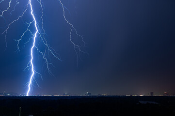Fototapeta na wymiar Lightning strike over night city
