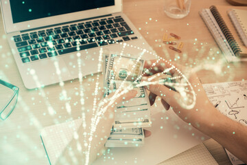 Multi exposure of dna drawing hologram and USA dollars bills and man hands. Medical education concept.