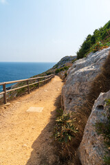 Obraz premium footpath leading to the Punta Palascia lighthouse near Otranto, Apulia, Italy