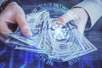 Multi exposure of technology drawing hologram and us dollars bills and man hands. Data concept