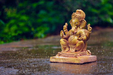 Water splash on lord ganesha sculpture. celebrate lord ganesha festival.
