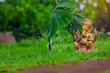 Water splash on lord ganesha sculpture. celebrate lord ganesha festival.