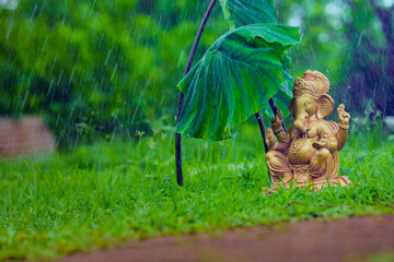 Water splash on lord ganesha sculpture. celebrate lord ganesha festival.