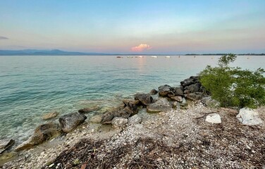 water of lake garda in italy surrounded by mountains