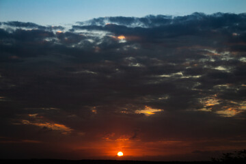 Solar disk during sunset. Golden and orange colors during the sunset