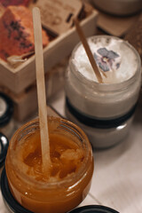 Glass jars with body creams or butter. Spa and beauty concept. Care cosmetics