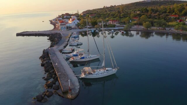 4k drone flight up footage (Ultra High Definition) of Aghios Georgios port. Calm summer sunrise in Peloponnese peninsula, Greece, Europe. Splendid morning seascape of Ionian sea..