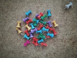 pins on a board background texture 