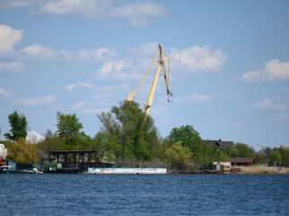 view of the river port with landing stage and cranes on a summer day. Kherson Ukraine