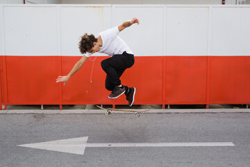 skateboarder does tricks outdoorin city © cherryandbees