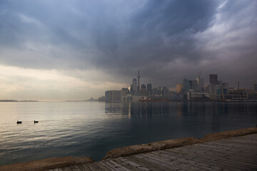 Naklejka premium Urban city skyline of Toronto, Canada in rainy weather