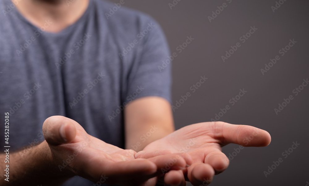 Poster man showing his empty hand.