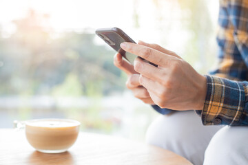 using cell phone hand holding mobile texting message contact us.chatting,search internet...