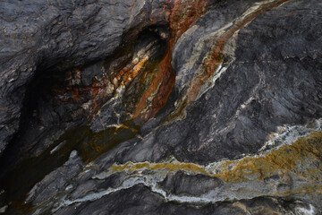 Minerals in the cliffs at Tregardock Beach Cornwall
