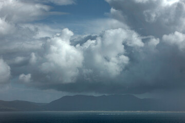 Fototapeta na wymiar Coast, ocean and clouds. Ireland. Ring of Kerry. South west coast.